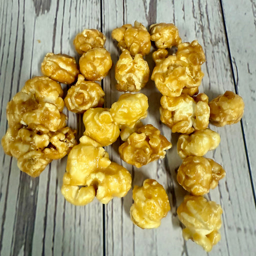 Peanut butter and marshmallow popcorn on a wooden surface